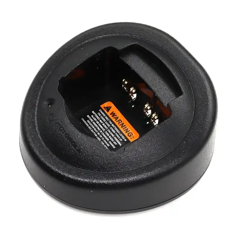 Black Motorola walkie talkie desktop charger with metallic contacts and orange warning label for GP328 HT750 models