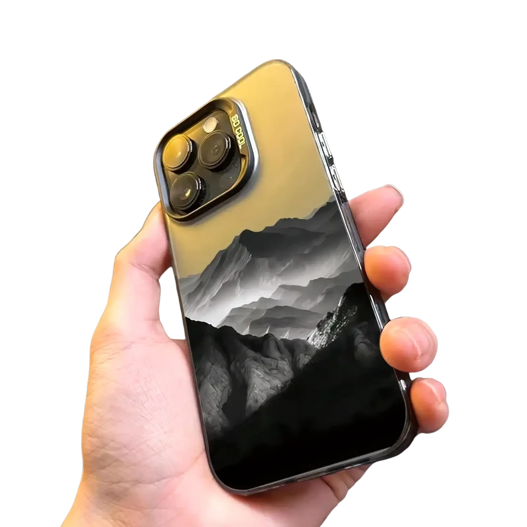 Back side of a sleek gold iPhone 13 Pro with a transparent glossy protective case featuring a black and white mountain design