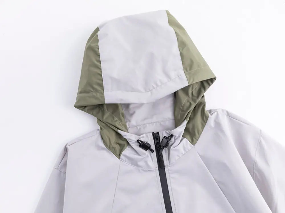Professional men’s tactical mountaineering assault jacket in light gray and olive green with black zipper front closure