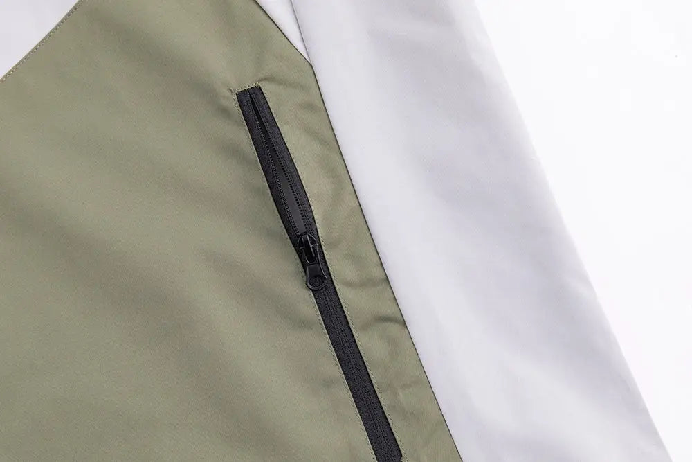 Professional men’s tactical mountaineering assault jacket in olive green nylon with black zipper shown from the back side