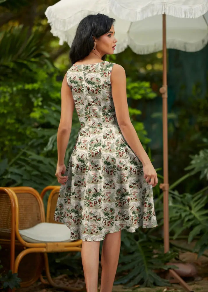 A sleeveless vintage mouse print cotton a line midi dress in light cream with floral pattern and pockets