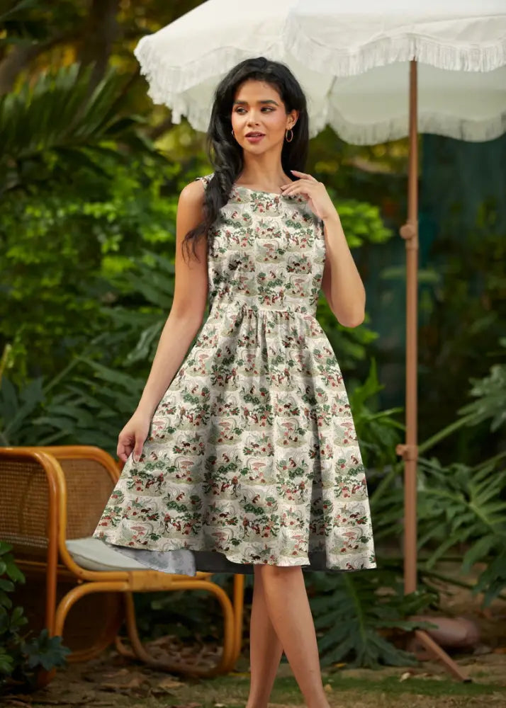 Sleeveless knee-length vintage mouse print cotton a line midi dress in light cream with floral green brown and muted red accents
