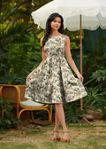 A sleeveless vintage mouse print cotton a-line midi dress with pockets in cream featuring green and muted red floral prints