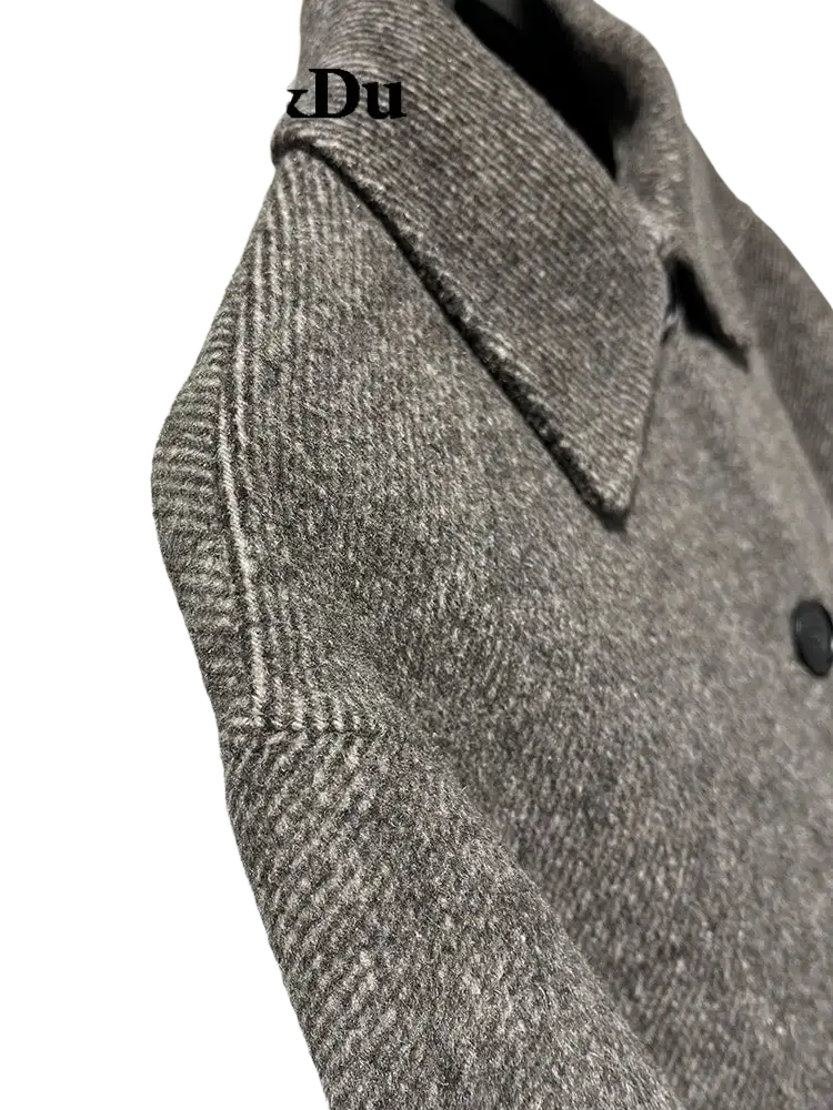 Mu&du gray herringbone wool coat with classic collar and black buttons featuring the mu&du logo