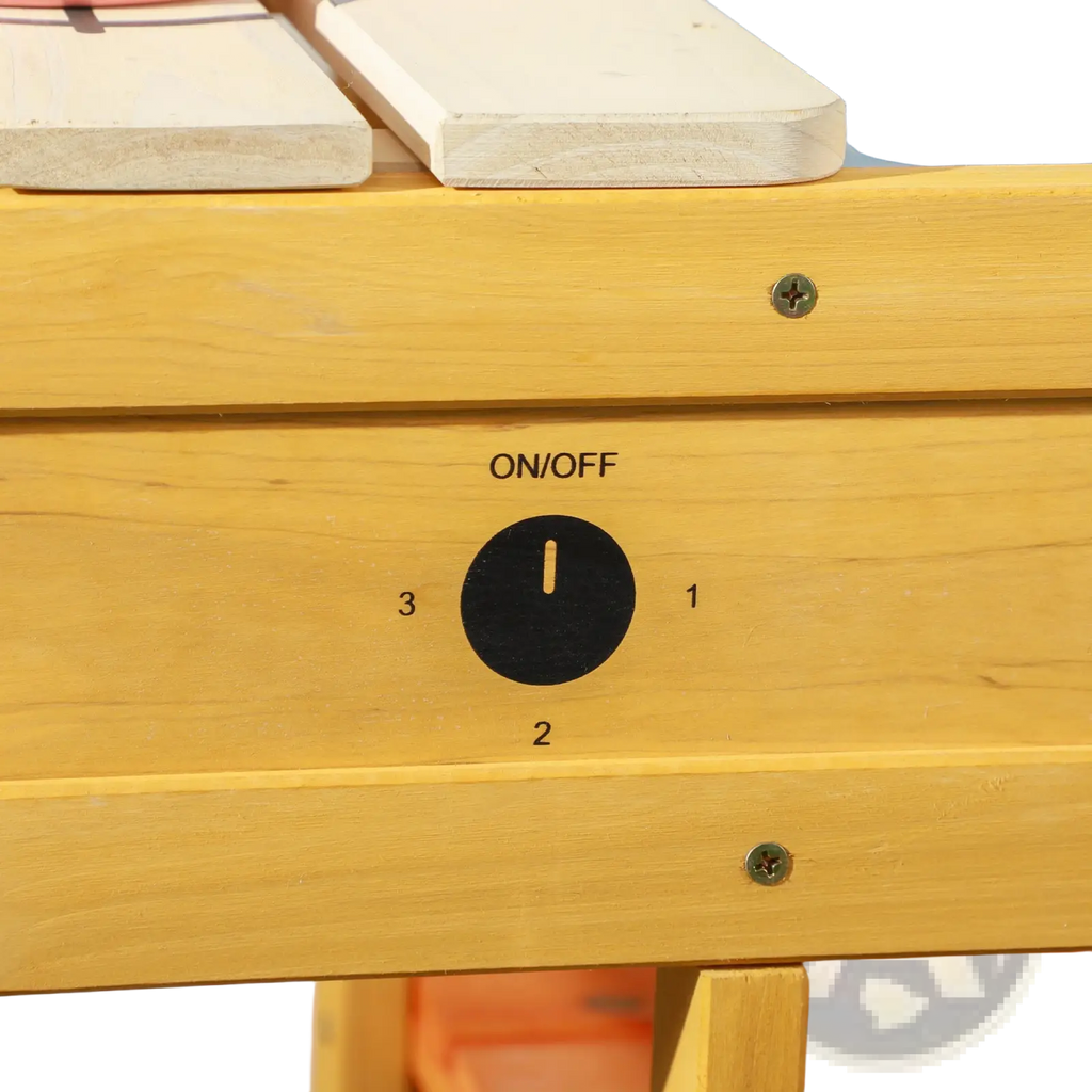 Yellow wooden outdoor mud kitchen for kids with black on off dial and numbered settings on the playset sink