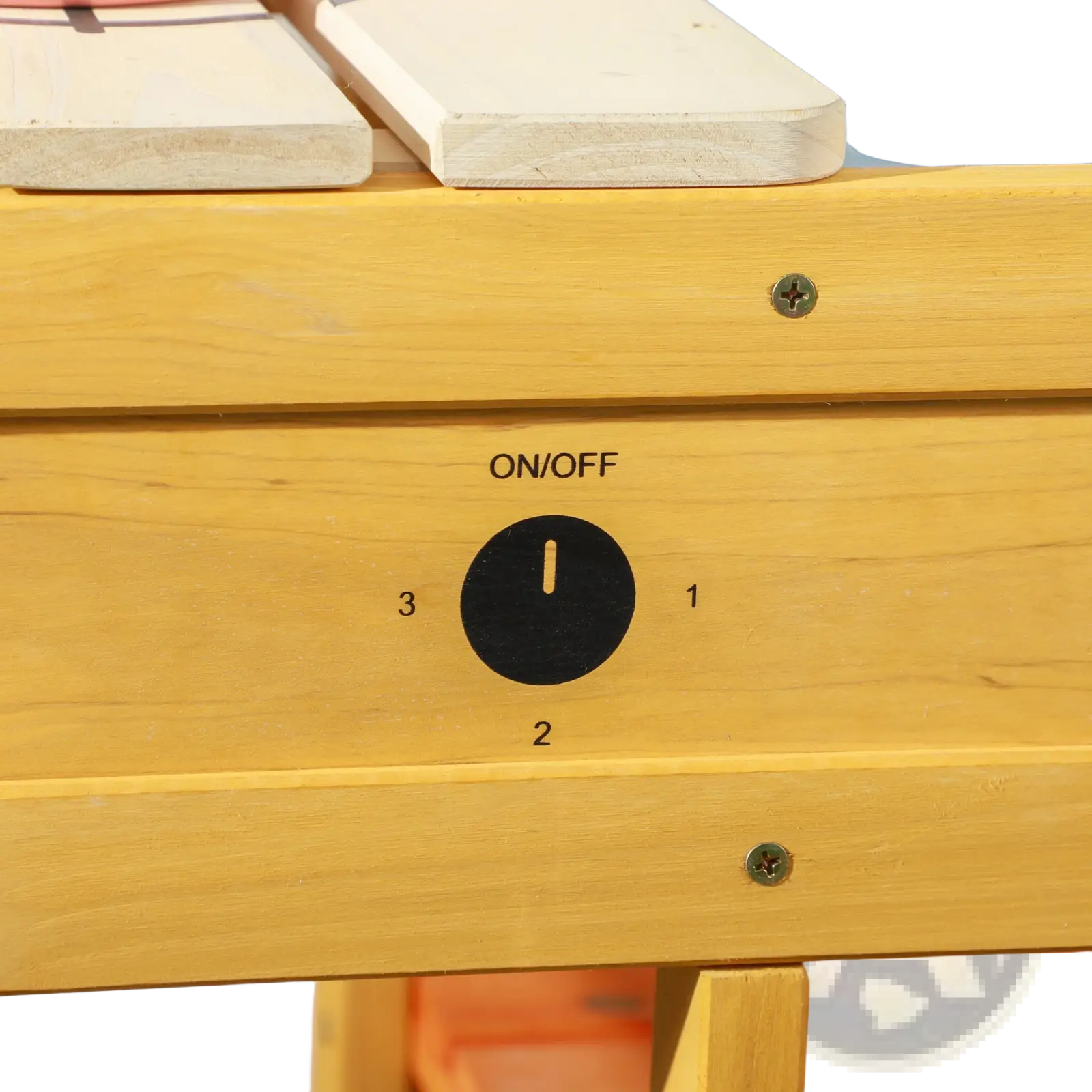 Yellow wooden outdoor mud kitchen for kids with black on off dial and numbered settings on the playset sink