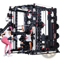 Multi-functional smith machine power rack in black and red with multiple weight stations and adjustable cables for strength training