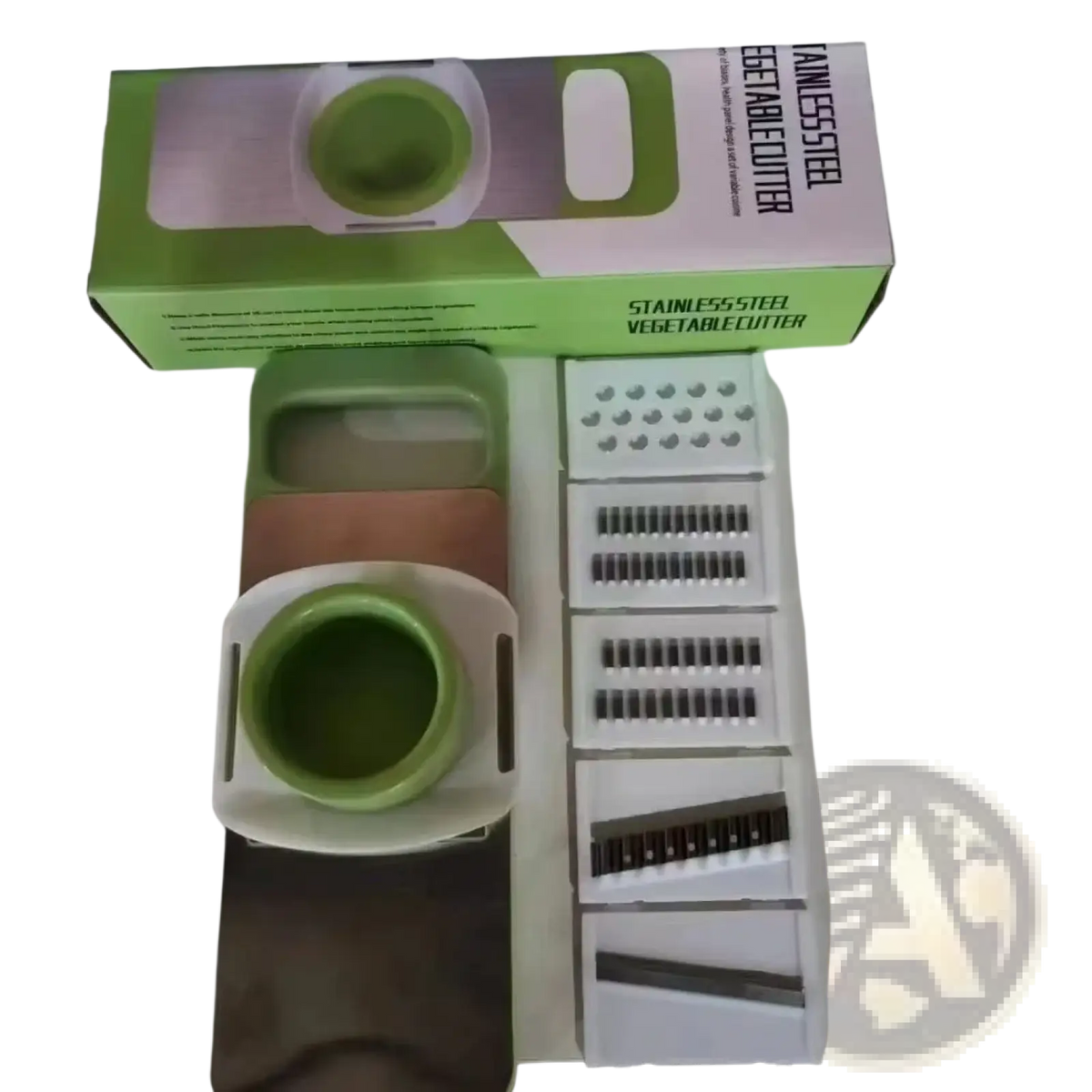 Multi-functional green and white stainless steel vegetable slicer shredder with interchangeable blades for versatile use