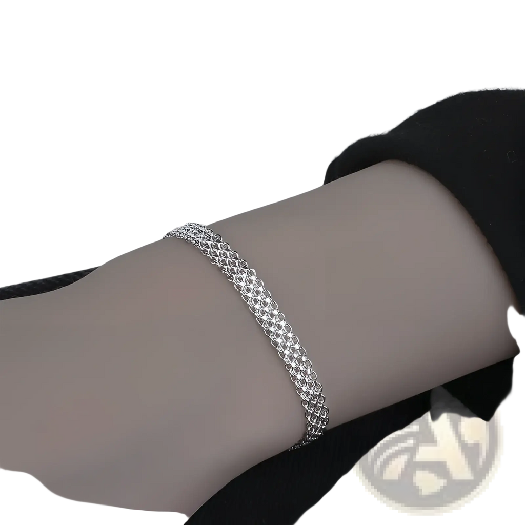 Multi-layer silver mesh bracelet with a delicate interwoven chain design and heart clasp in silver tone