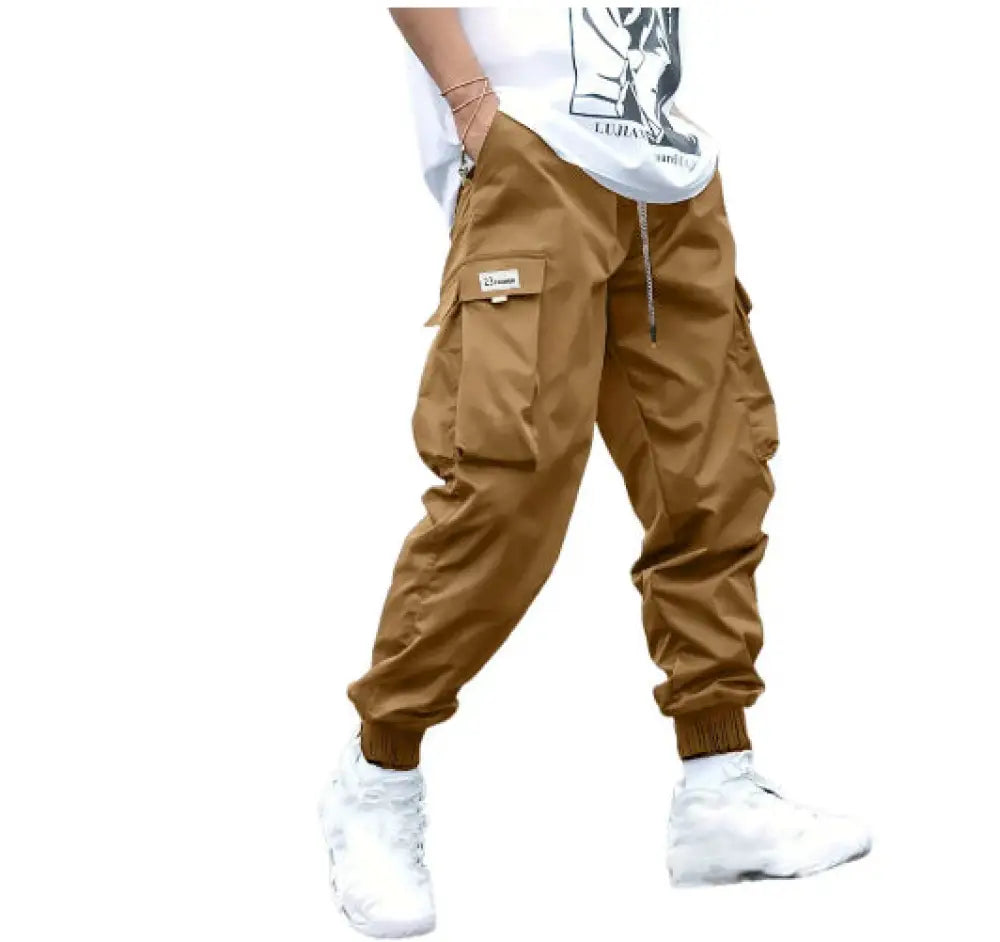 Men’s multi-pocket streetwear cargo joggers in tan with multiple pockets and a drawstring waistband