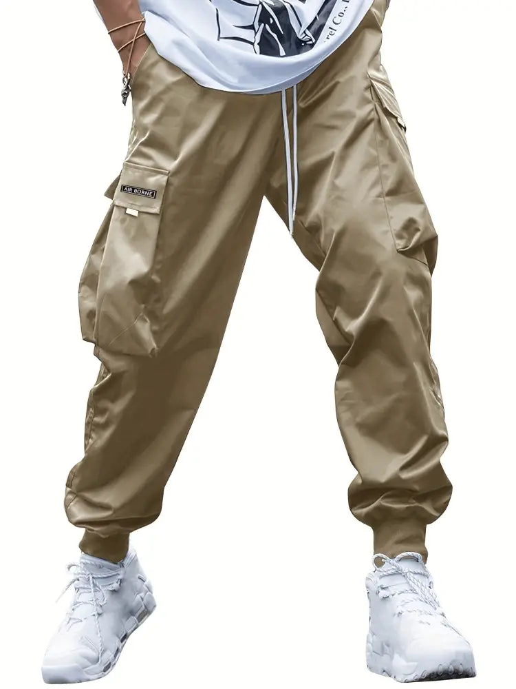 Men’s khaki cargo joggers with multiple pockets and drawstring waistband designed for streetwear and casual use