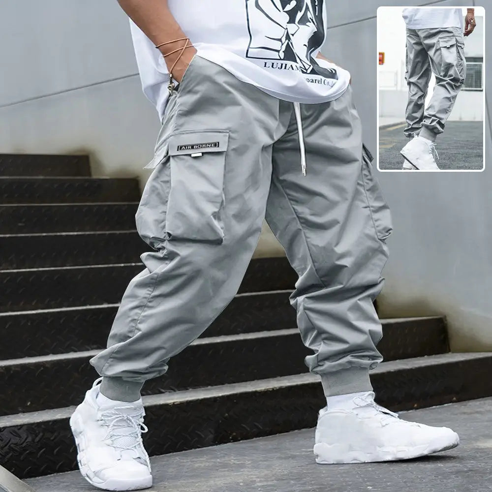 Men’s gray multi-pocket streetwear cargo joggers with drawstring waistband designed for casual comfort