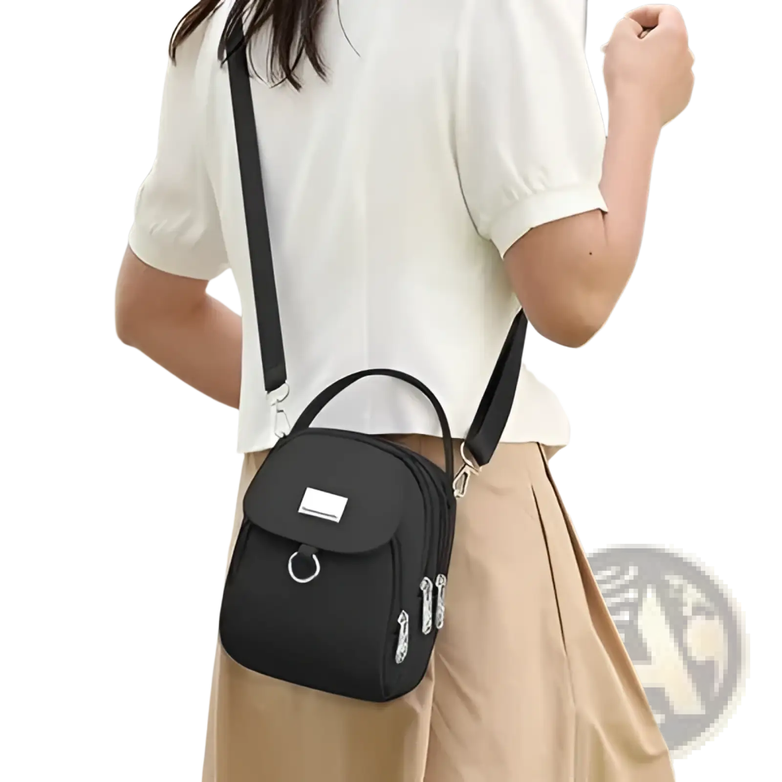 Black compact nylon crossbody bag with front flap, silver metal hardware, zippers, and earbud case attachment