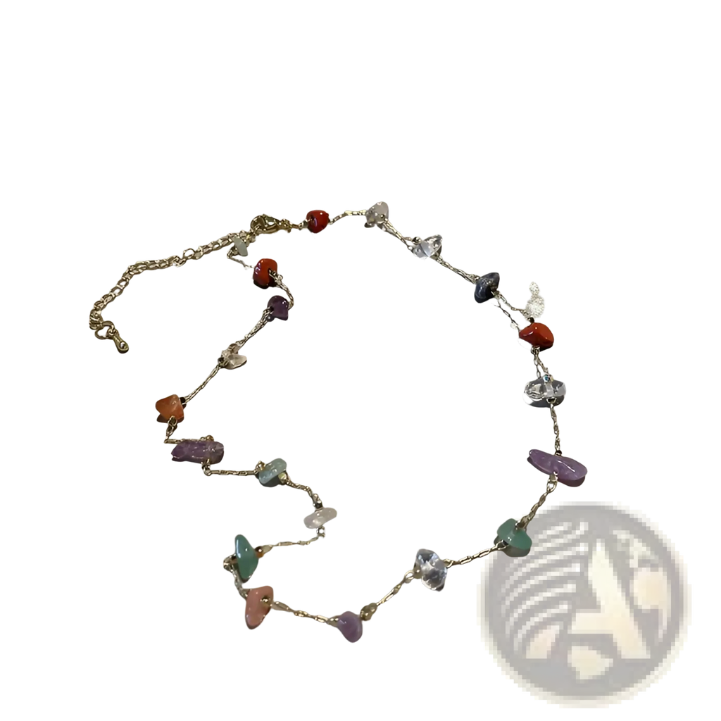 Multicolor gemstone choker in gold and silver alloy with irregular red purple green and clear stones on a silver chain