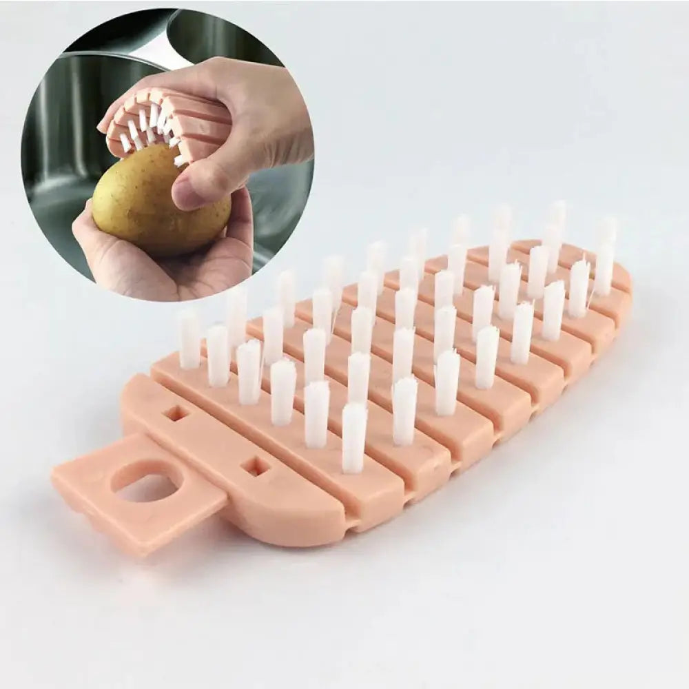 Pink flexible silicone vegetable and fruit cleaning brush with white bristles for effective scrubbing