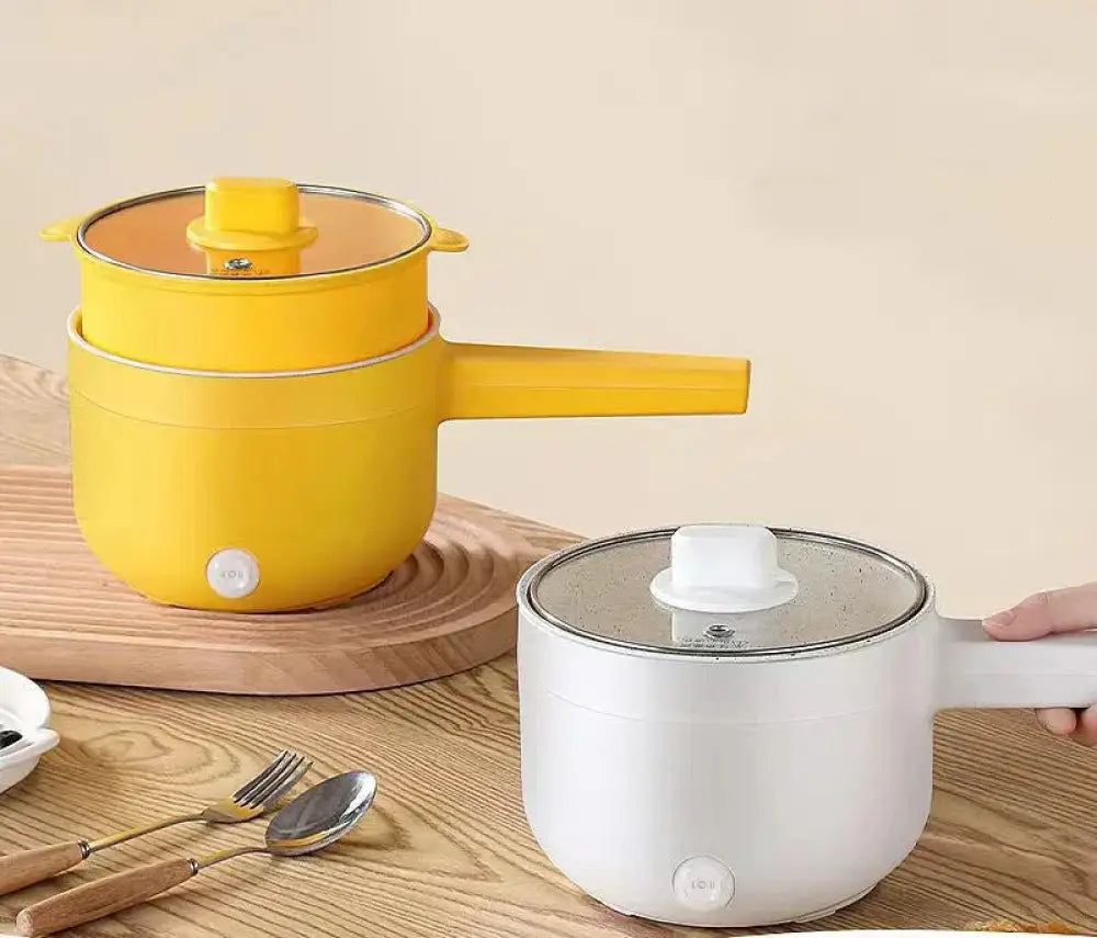 Yellow electric mini multi cooker with glass lid and handle for hot pot and frying pan cooking
