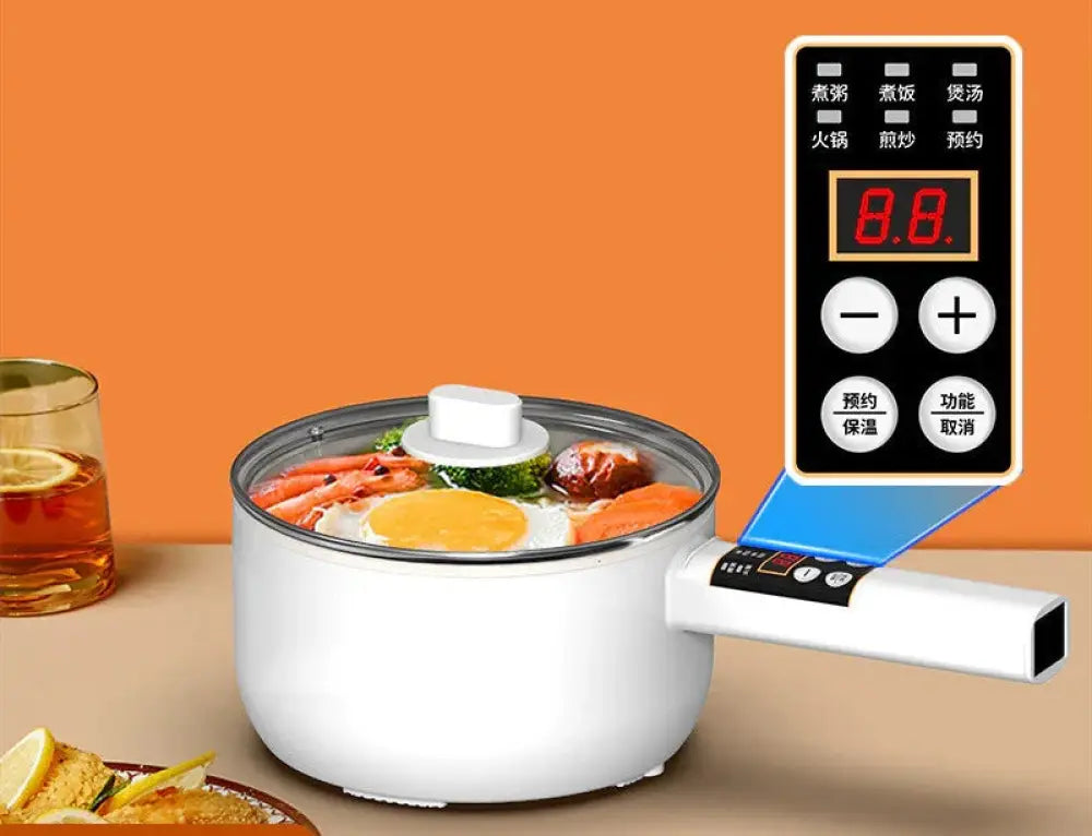 White electric mini multi cooker with digital control panel and transparent lid cooking eggs carrots broccoli and meat