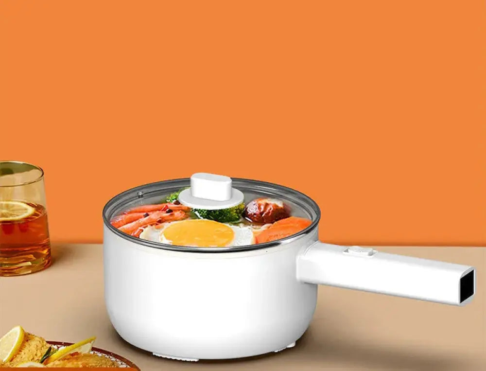 White electric mini multi cooker hot pot and frying pan with clear glass lid and white handle in modern minimalist design