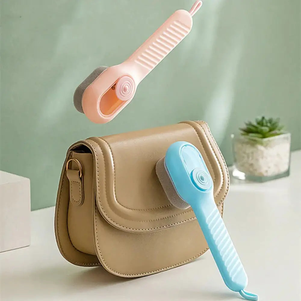 Multifunctional gentle sponge leather cleaning brush with pink and blue plastic textured grip handle