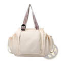 Cream-colored multifunctional waterproof nylon tote bag with patterned woven straps and a front zippered pocket