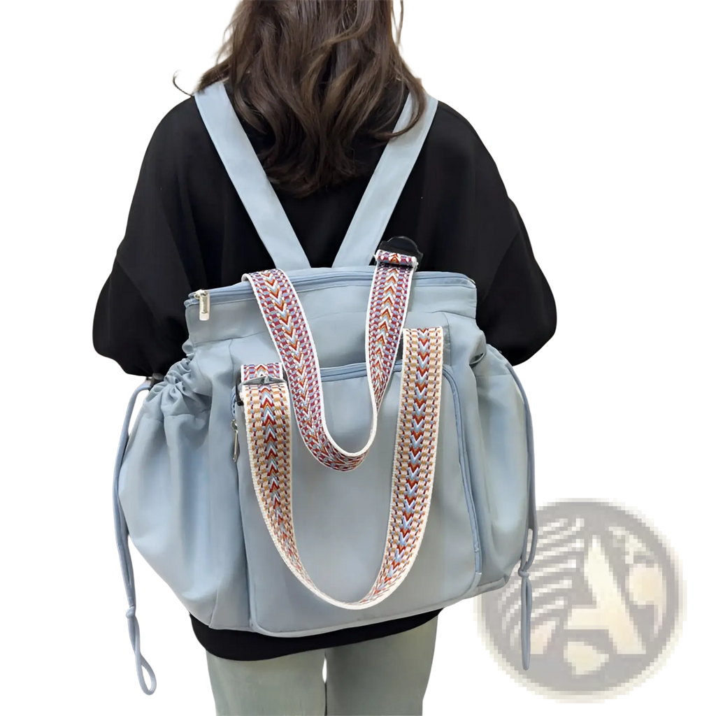 Light blue canvas multifunctional waterproof nylon tote and backpack with braided straps and geometric pattern