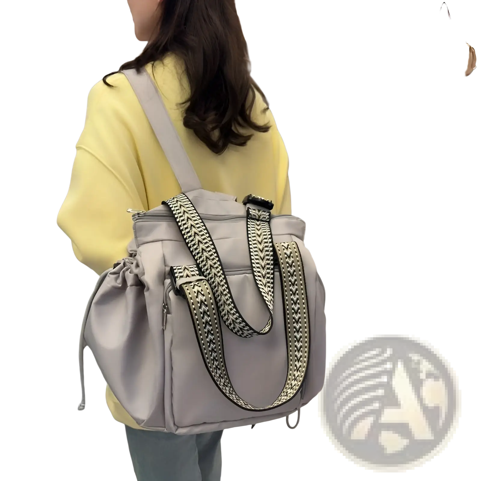 Gray nylon multifunctional waterproof tote and backpack with black and white geometric patterned shoulder straps