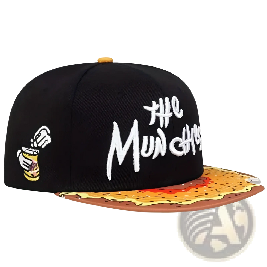 Black snapback cap with white embroidered the munchies text and cartoon hand holding chip can on flat fried food brim