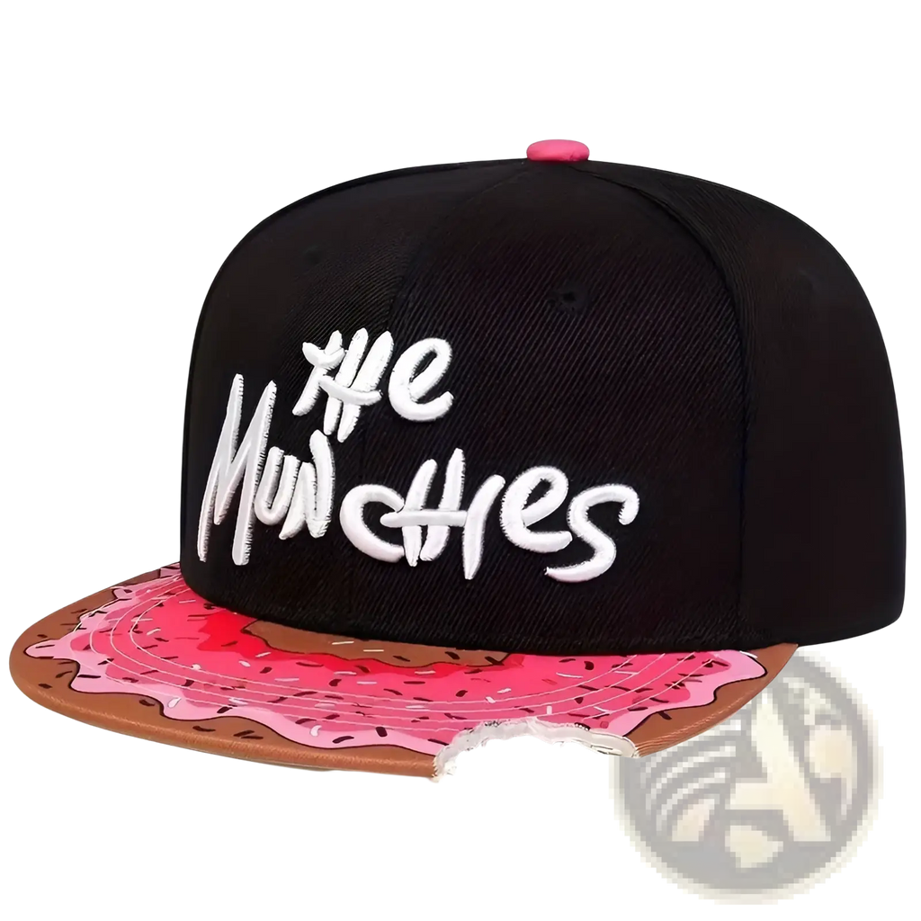 Black flat brim snapback cap with white embroidered the munchies text and pink frosted donut design on brim