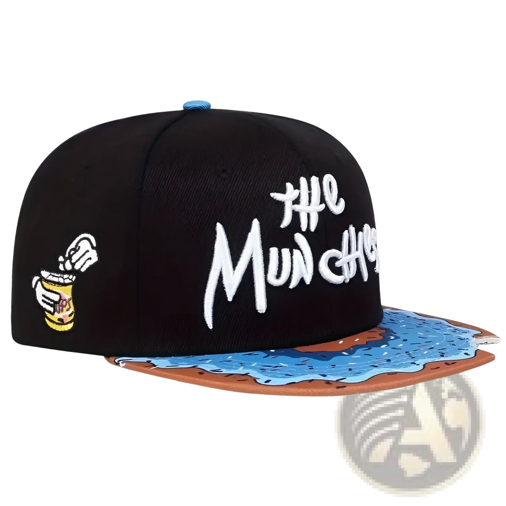 Black snapback cap with white embroidered the munchies text, cartoon hand patch, and melted chocolate flat brim