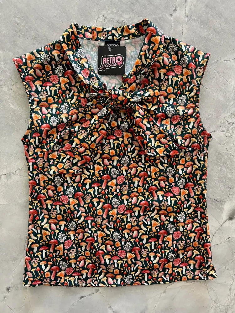 Vintage mushroom print sleeveless bow top in black featuring a vibrant colorful mushroom pattern in red orange and pink