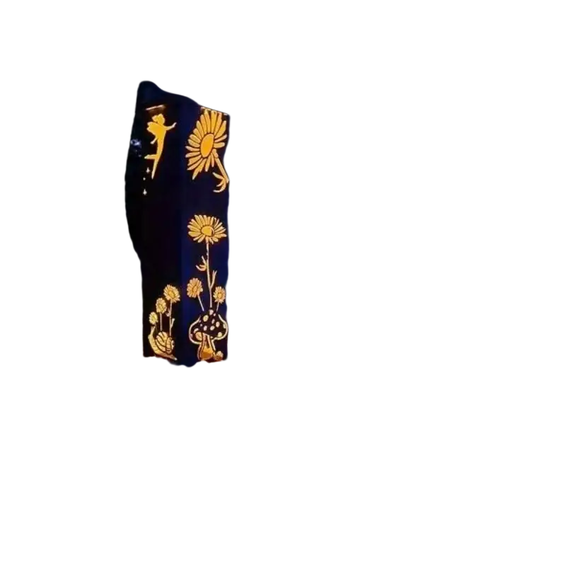 Black metal mushroom garden column with illuminated golden cutouts of fairies sunflowers and mushrooms for outdoor use