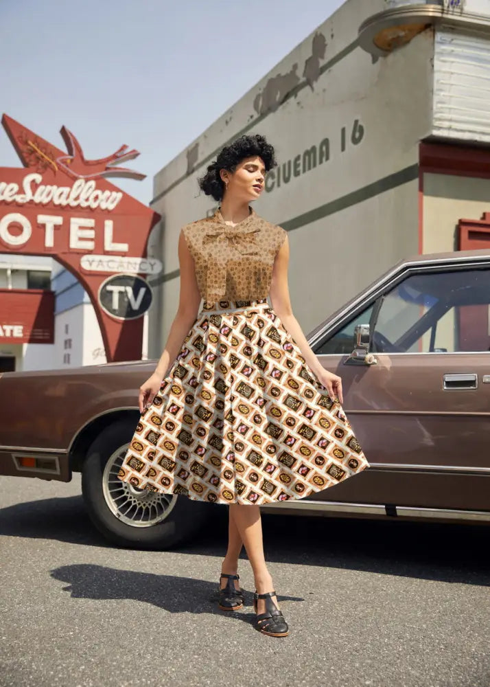 Vintage mushroom portrait print Doris flared cotton skirt in beige and brown geometric pattern with bow neckline