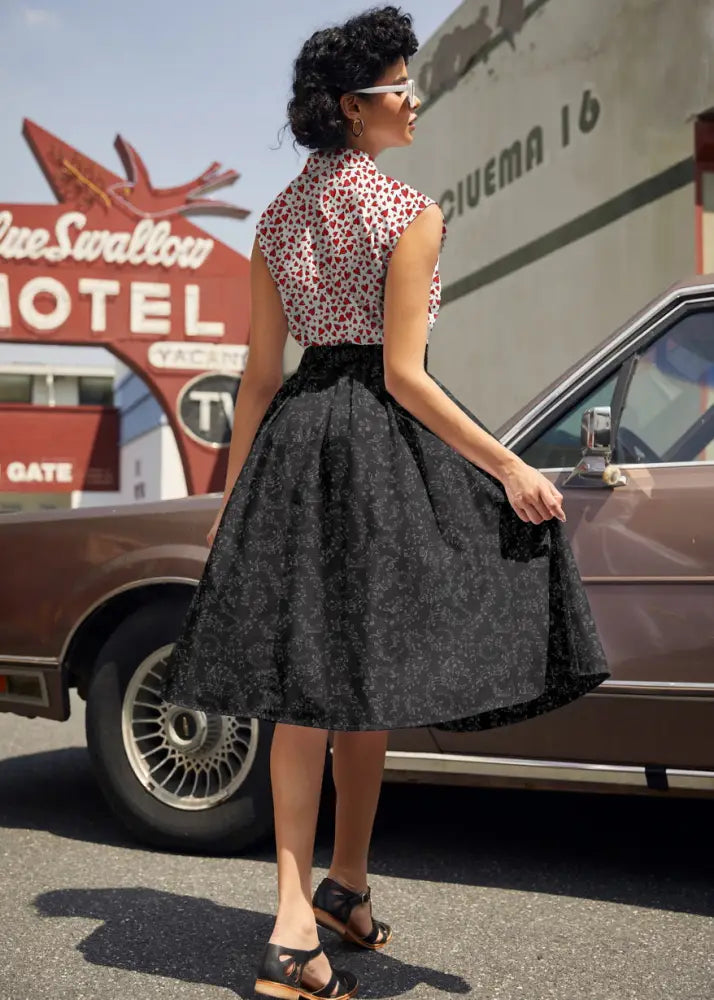 Black music notes high waisted pleated cotton a-line skirt with fitted waistband and flared hem