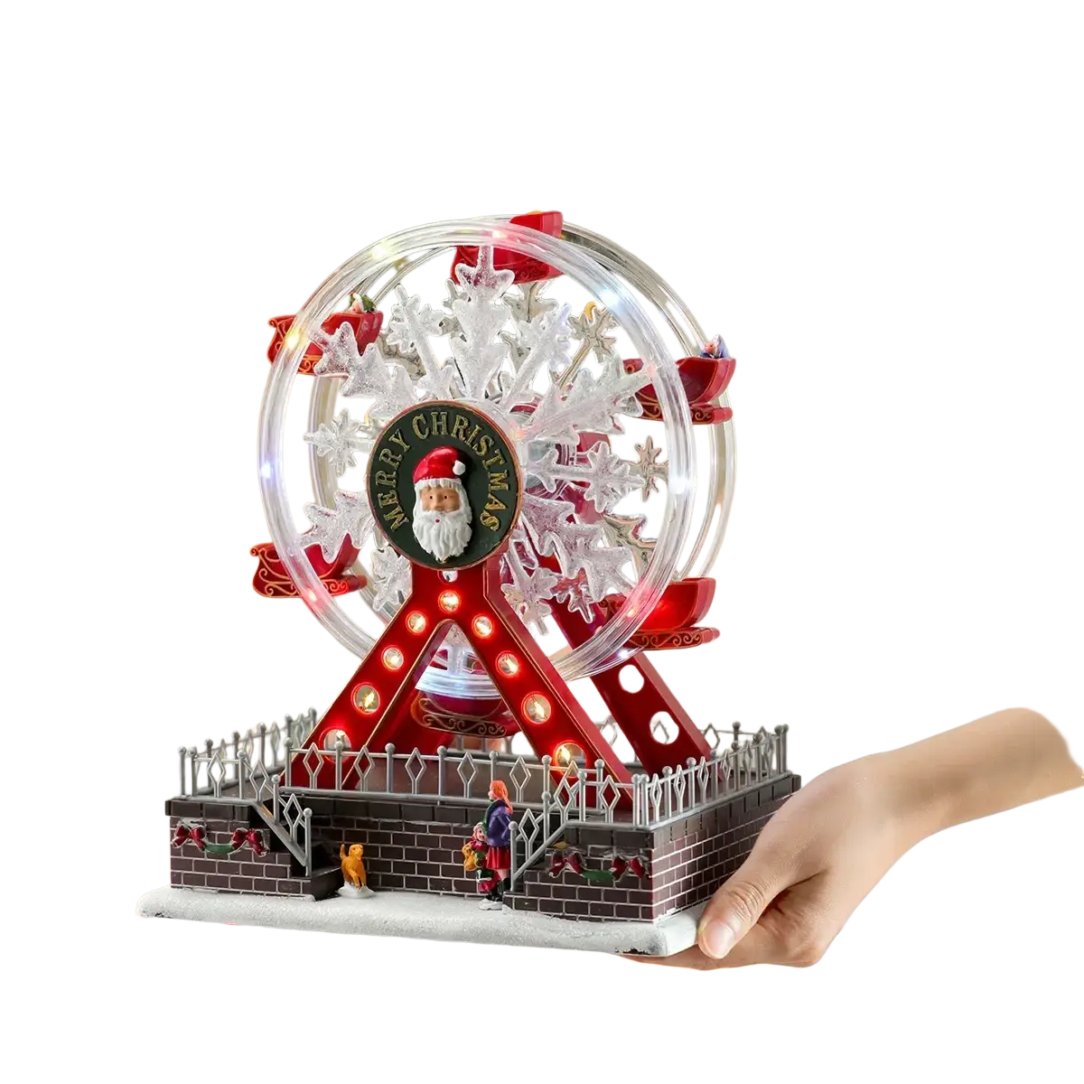 A festive red and clear musical christmas ferris wheel ornament with illuminated lights and santa claus emblem