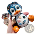 Musical dancing penguin toy for toddlers in blue and white with orange beak pink feet and colorful buttons on belly