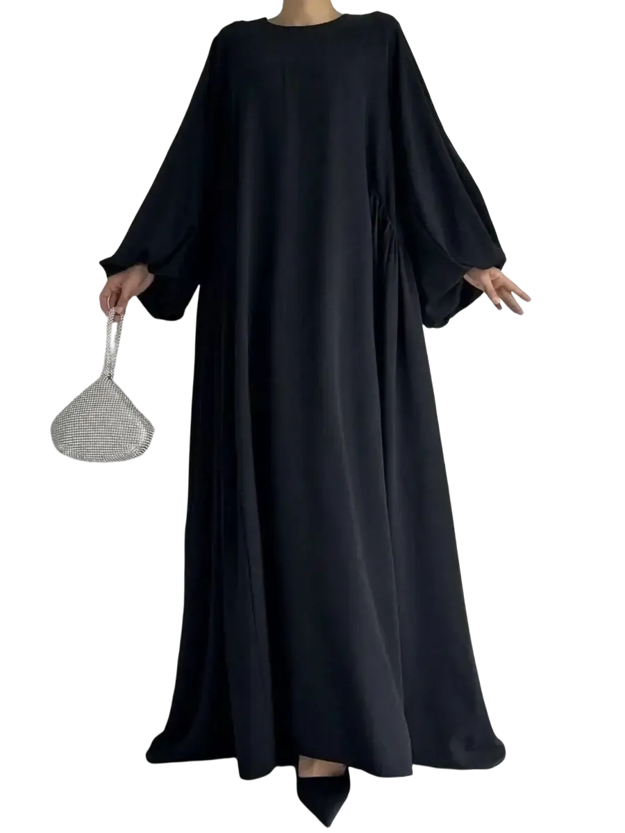 Black long-sleeved flowing Muslim abaya maxi dress with round neckline and gathered waistline for modest casual wear