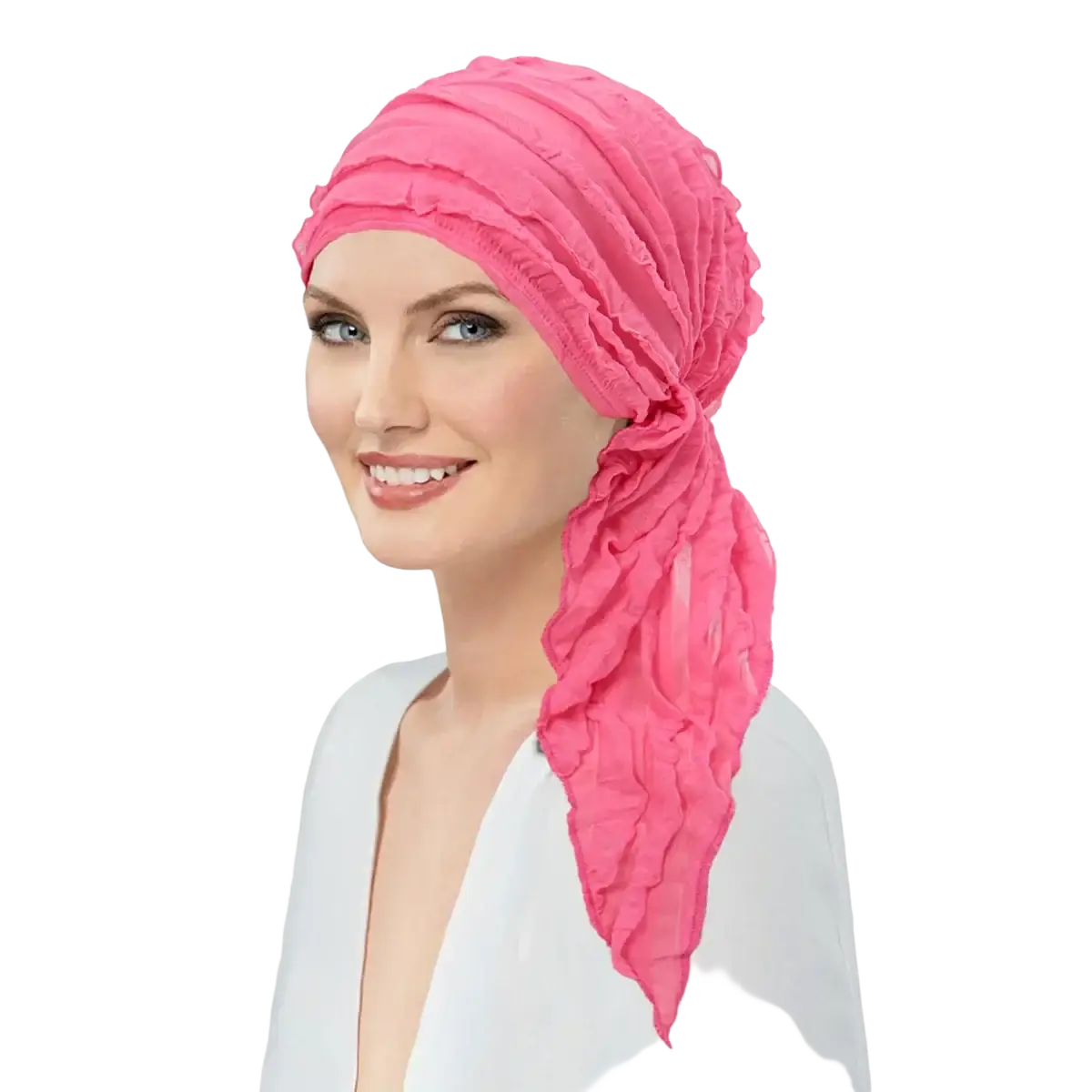 A vibrant pink ruched fabric muslim hijab turban hat with ruffle design and flowing tail for chemo use