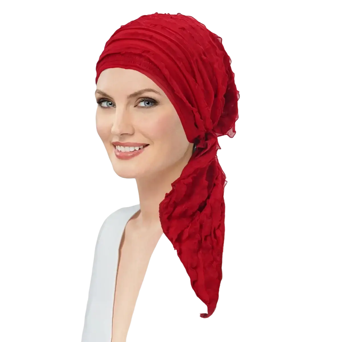 A vibrant red ruched fabric muslim hijab turban hat with ruffle detail and flowing tail for chemo use