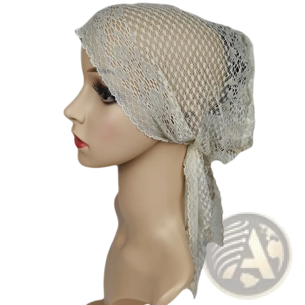A delicate off-white Muslim turban lace cap with breathable mesh texture and subtle floral patterns for chemo headwear