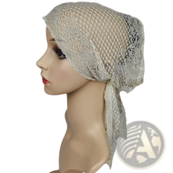 A delicate off-white Muslim turban lace cap with breathable mesh texture and subtle floral patterns for chemo headwear