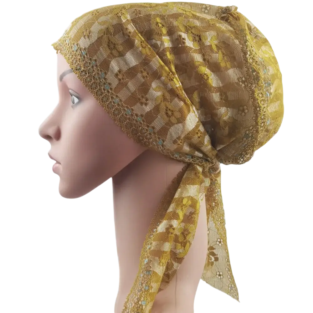 A delicate gold-toned lace floral muslim turban cap with decorative beaded trim for chemo headwear