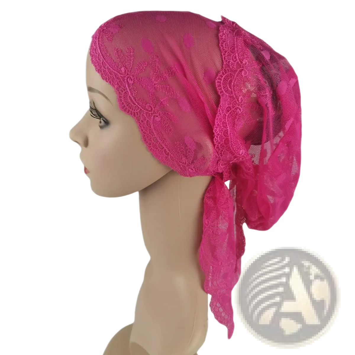A vibrant fuchsia muslim turban lace cap with floral patterns and sheer mesh tied elegantly for chemo headwear