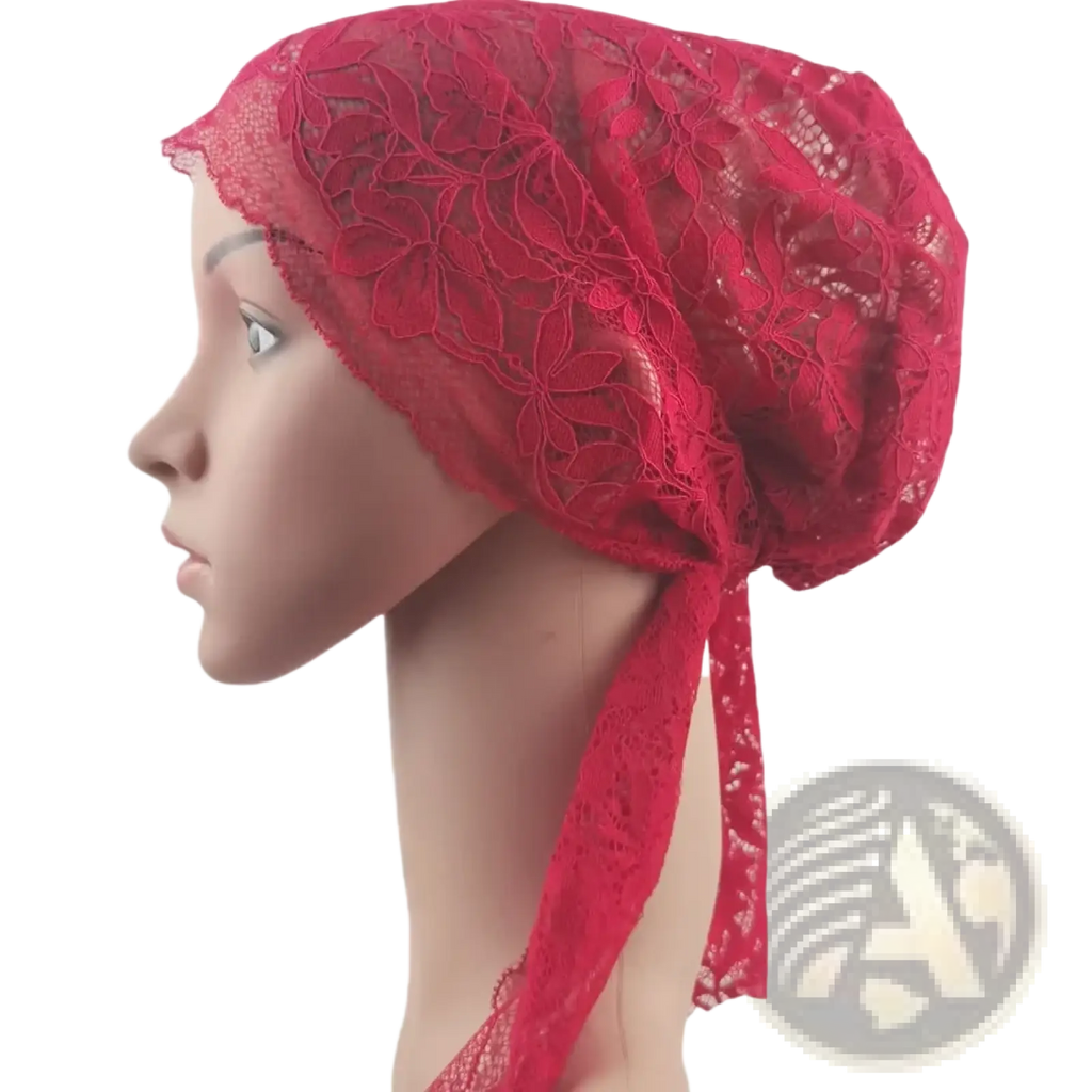 A vibrant red lace muslim turban featuring intricate floral patterns and a tied-back design for chemo headwear