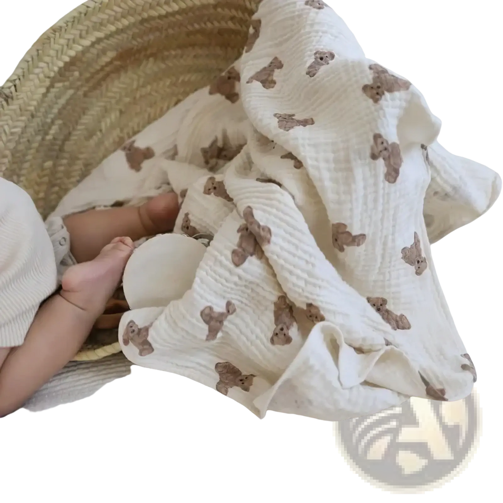 Muslin bear print baby bath towel and swaddle blanket in soft off-white with waffle texture and brown teddy bear prints