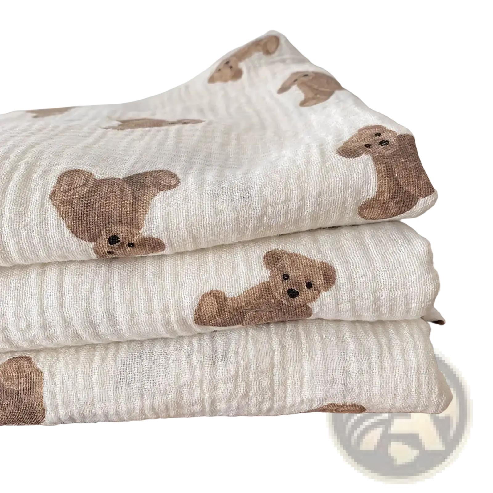 Stacked beige muslin bear print baby bath towels and swaddle blankets with soft textured weave
