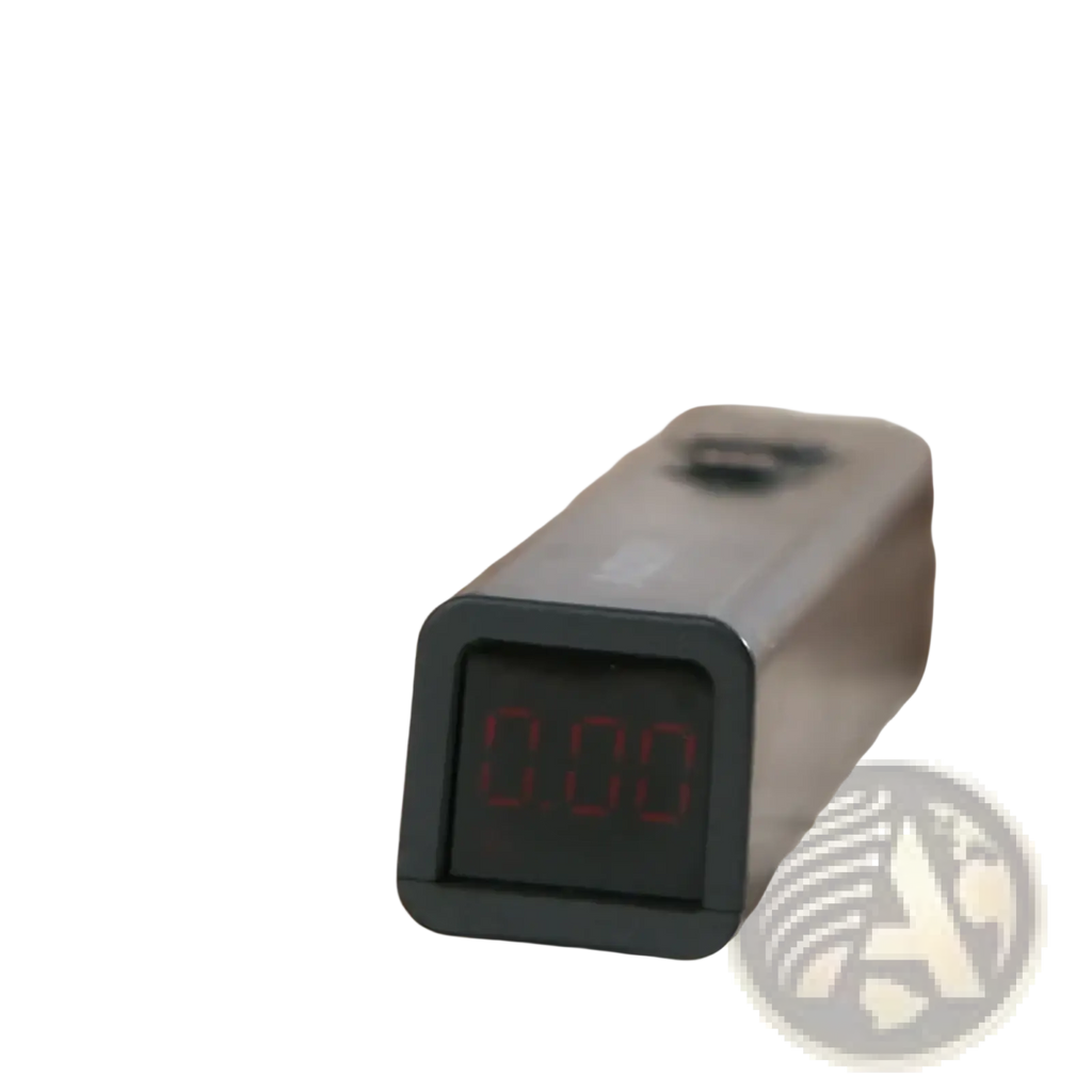 Black digital thermometer with rectangular display showing red numerals beside muslin cotton baby swaddle blanket