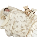 Muslin cotton baby swaddle blanket in soft cream with gray bunny print and delicate lace trim