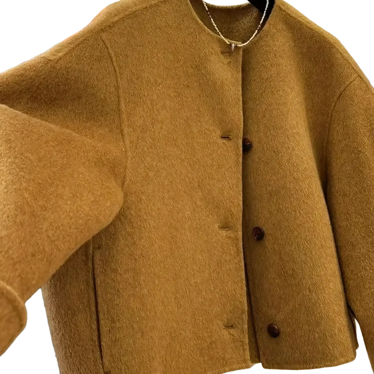 A cozy mustard yellow wool blend short coat for women with a round neckline and dark brown buttons