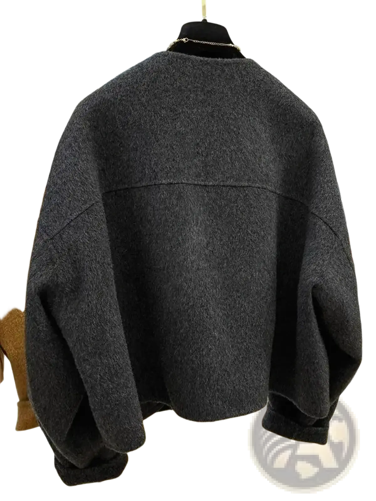 Dark gray oversized knit sweater with relaxed fit and ribbed cuffs paired with mustard yellow wool blend short coat women