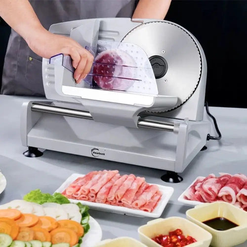 Adjustable electric meat and deli slicer with silver and black metal body, precision rotating blade, clear plastic guard, and guide